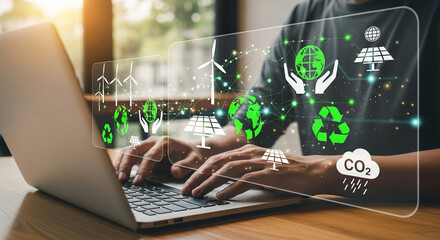 Person using laptop with overlay of green energy icons and symbols representing sustainability ideas