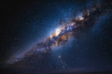 Fototapeta premium Stars illuminate the night sky showcasing the beauty of the Milky Way galaxy over a tranquil landscape