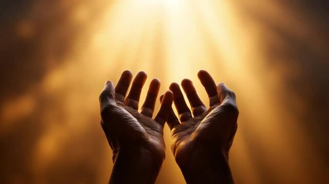 Hands Raised in Prayer: Open hands reaching up towards a radiant, golden light, symbolizing hope, faith, and spiritual connection.  