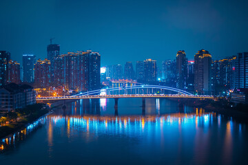 Naklejka premium Illuminated City Bridge Reflected in River at Night