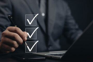 Business Performance Checklist Businessman Using Laptop Doing Online Checklist Survey On Computer...