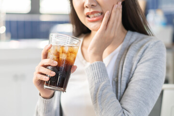Close-up woman touching her cheek feeling sensitive teeth