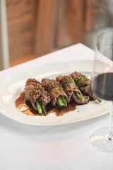 Portion of gourmet beef and asparagus rolls appetizer