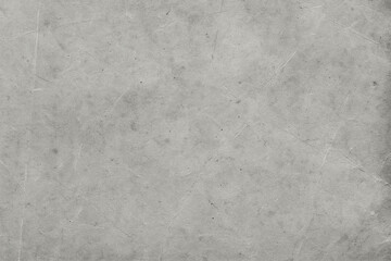 Naklejka premium Rough gray concrete surface with visible scratches and worn marks, ideal for backgrounds, industrial designs, or grunge-style creative projects.