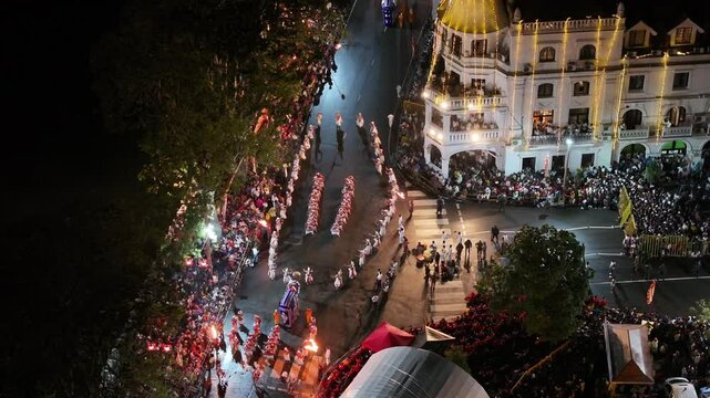 Aerial footage of the Kandy Esala Perahera, Sri Lanka&rsquo;s most iconic cultural festival. The drone captures the grand procession with traditional dancers, fire performers, drummers, and richly adorned e