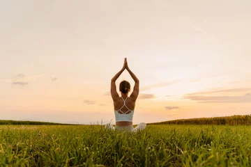  Young woman practicing yoga on nature. Holistic Health and Mental Well-Being. © nataliaderiabina