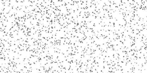 Abstract mosaic pattern with irregular shapes in shades of gray scattered across a white background forming a textured visual element suitable for various creative designs.