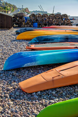 Lobster crab pots and canoes on the beach at Budleigh Salterton, Devon, United Kingdom