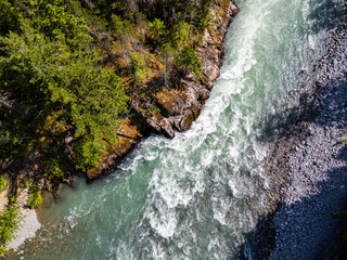 Aerial View of a Pristine River Flowing Through a Forest in BC, Canada