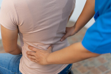 Person receiving back massage for pain relief