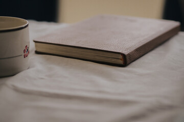 book with cup of coffee, side view