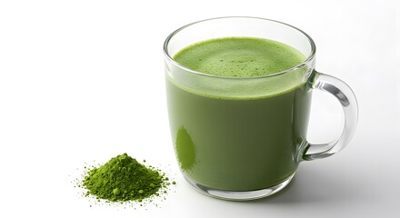 A glass mug filled with vibrant green matcha tea, accompanied by a small pile of matcha powder. The drink looks refreshing and invigorating.