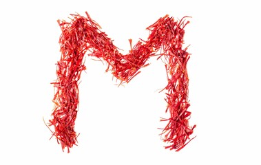 M English Alphabet Capital Letter Created with Organic Saffron or Kesar Heap Isolated on White Background with Copy Space, Kindergarten Children Education and Learning