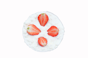 Fresh strawberries arranged on creamy white dessert top, presented on clean background for a vibrant culinary display