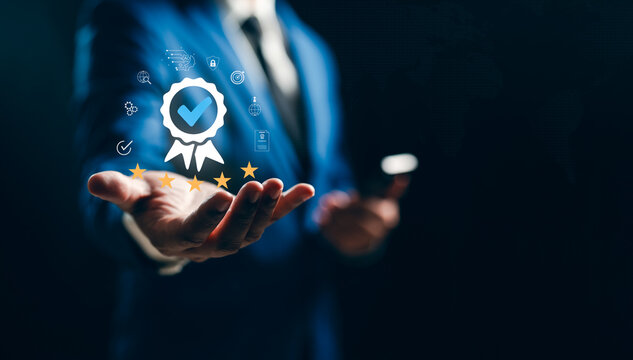 Businessman hand shows sign feedback of evaluation top service best Quality assurance 5 stars, Review, Guarantee, Standard. Standardization and ISO certification Concept.