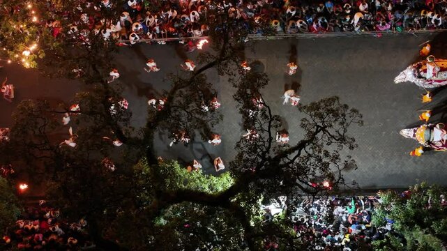 Aerial footage of the Kandy Esala Perahera, Sri Lanka&rsquo;s most iconic cultural festival. The drone captures the grand procession with traditional dancers, fire performers, drummers, and richly adorned e