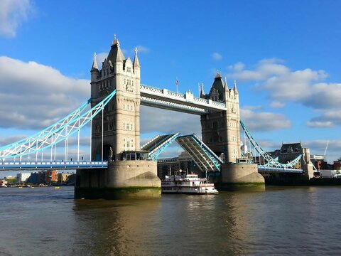 Tower Bridge with raised bascules in London