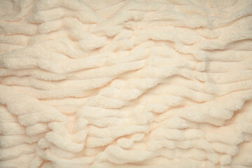 Beige soft blanket background. Space for text. Plaid