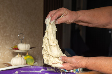 mom makes a lot of pies out of dough. High quality photo
