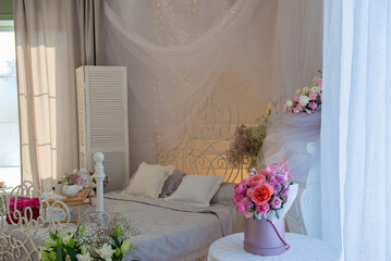 Beautiful floral interior with bed. High quality photo