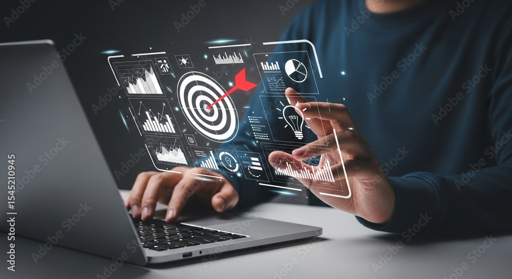 Poster Person using laptop with digital interface showing target and data visualizations overlayed