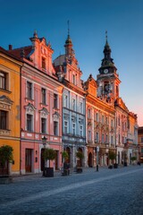 Fototapeta premium Colorful Historic Buildings Under a Clear Sky During Sunset in a European City.