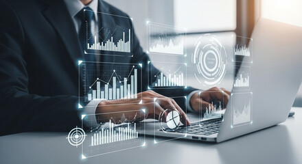 A person in a suit using a laptop with data visualizations and graphs overlaid on the screen and desk