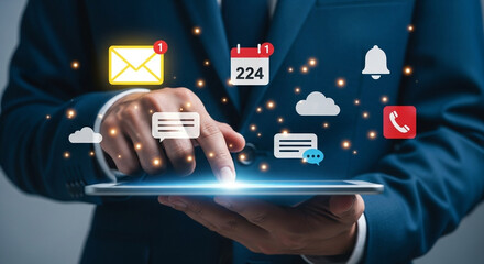 Person in suit using tablet with email calendar and notification icons floating around the device
