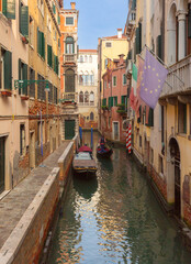 Traditional residential buildings with flowered balconies in Venice, Italy