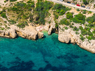Krk island, Croatia. Aerial view of a small, rocky beach along the road to Stara Baška