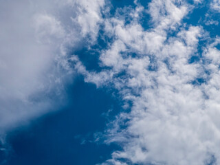 Dynamic Blue Sky with Fluffy White Clouds in Motion