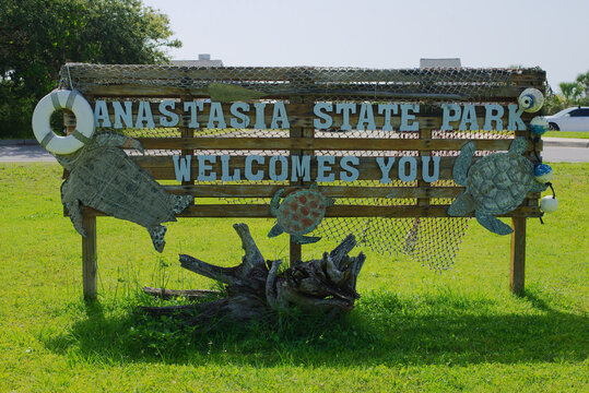 Welcome Sign at Anastasia State Park with Nature and Art Sculptures. Editorial Use Only June 6, 2025 St. Augustine, FL. USA. Featuring artistic marine-themed decorations at Park against a bright summe