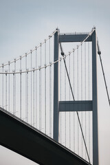 Fragment of big modern suspension bridge on sunny day against clear sky, Istanbul, Turkey