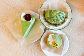 Close-up of matcha cake dessert in Asian Chinese bakery restaurant with warm colors