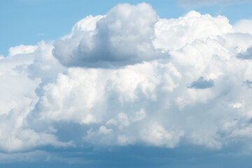 Сumulus clouds on a sunny day, side view