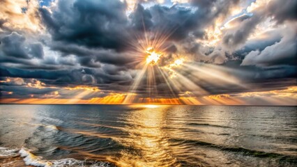 Dramatic ocean sunset with sun rays breaking through clouds  