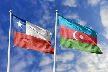 Flags of Chile and Azerbaijan Waving Together Against a Blue Sky, Symbolizing Diplomatic Relations and International Friendship