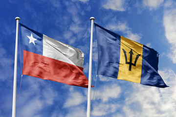 Flags of Chile and Barbados Waving Together Against a Blue Sky, Symbolizing Diplomatic Relations and International Friendship