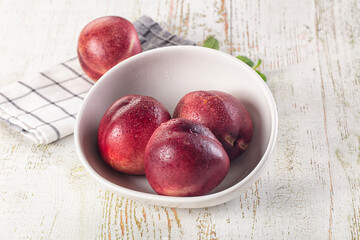 Ripe sweet juicy nectarines heap