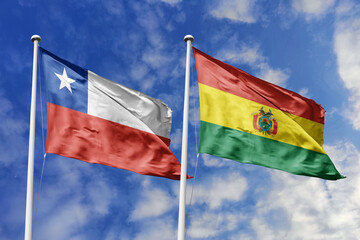 Flags of Chile and Bolivia Waving Together Against a Blue Sky, Symbolizing Diplomatic Relations and South American Ties