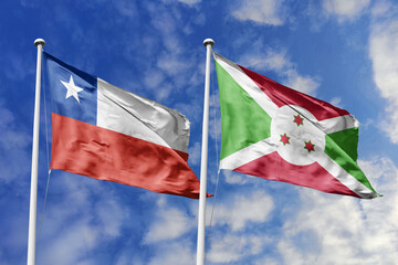 Flags of Chile and Burundi Waving Together Under a Blue Sky, Symbolizing Diplomatic Relations and...
