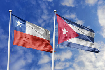 Flags of Chile and Cuba Waving Side-by-Side Against a Bright Blue Sky, Symbolizing Diplomatic...