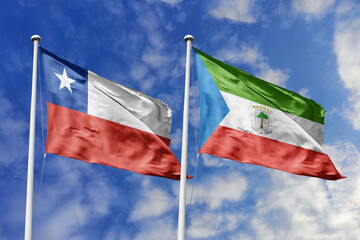 Flags of Chile and Equatorial Guinea Waving Together Against a Dynamic Blue Sky, Symbolizing...
