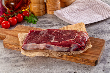 Gourmet raw rib eye steak