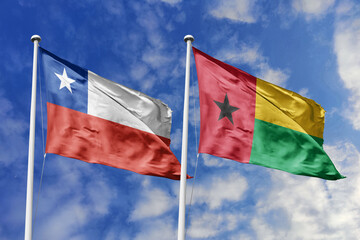 Flags of Chile and Guinea-Bissau Waving Together Against a Dynamic Blue Sky, Representing Bilateral...