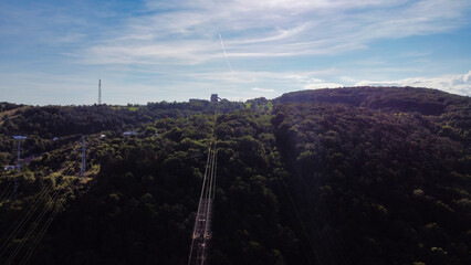 View of old rusty tower on the outskirts of Kosice. Trees and hills. Slovakia. Europe	