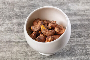 Unpeeled cashew nuts in the bowl