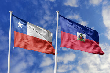 Flags of Chile and Haiti Waving in the Wind Against a Blue Sky, Representing Bilateral Relations and Shared Aspirations