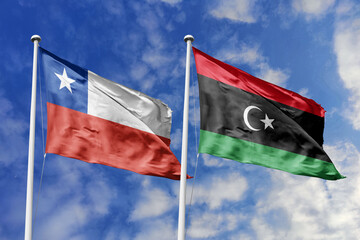 Flags of Chile and Libya Waving Together Under a Bright Blue Sky, Symbolizing International...