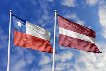 Flags of Chile and Latvia Waving Together Under a Bright Blue Sky, Symbolizing International...